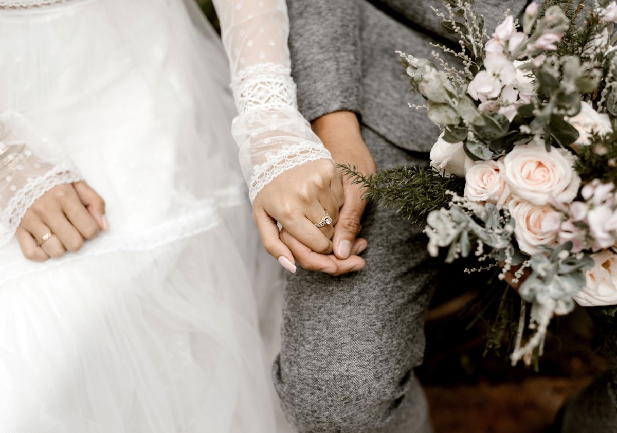 Newly married couple with MUSAT wedding limousine, luxury chauffeur for weddings NYC and Long Island