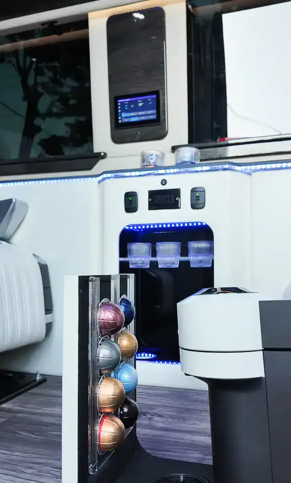 Coffee machine inside the MUSAT Mercedes-Benz Sprinter, used for holiday party transportation in NYC
